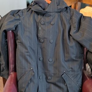Oakley Anorak Men's Black Pinstripe Snowboarding Jacket with powder skirt.
